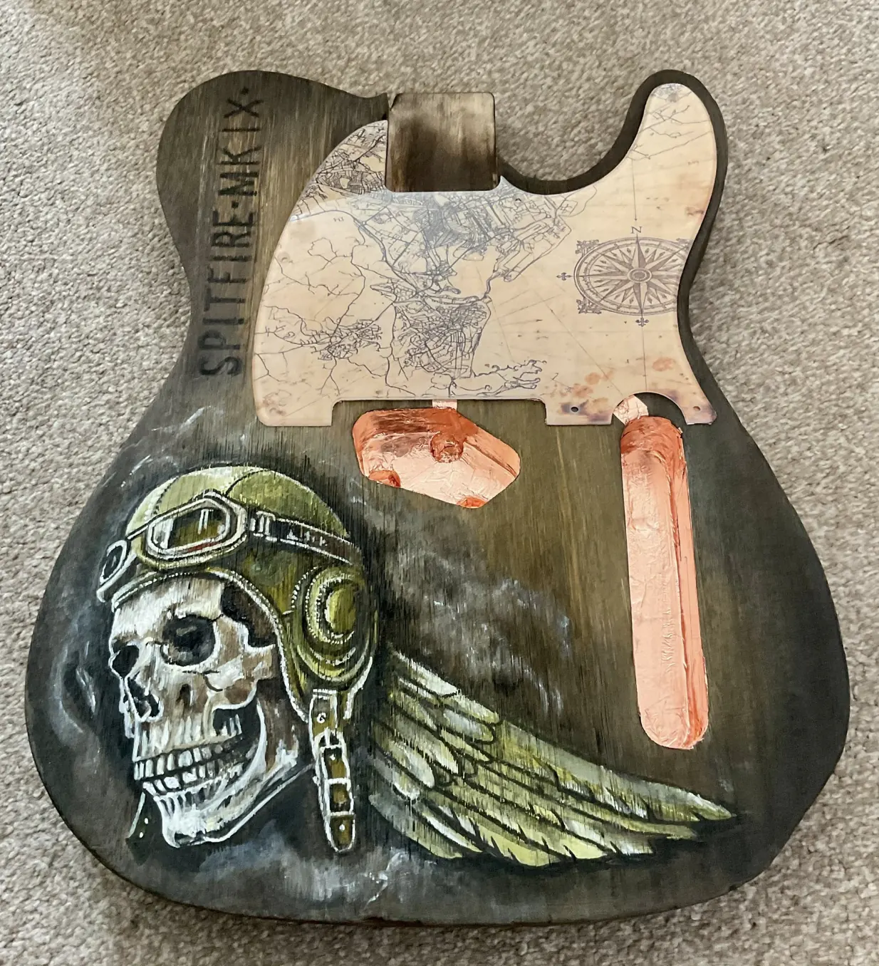 Guitar body with copper foil in the routed control cavity